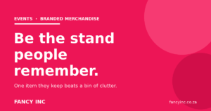 Branded merchandise for events on a busy exhibition stand with a queue of visitors